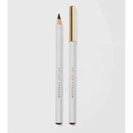 A white eyeliner pencil with its cap placed to the side on a light background.